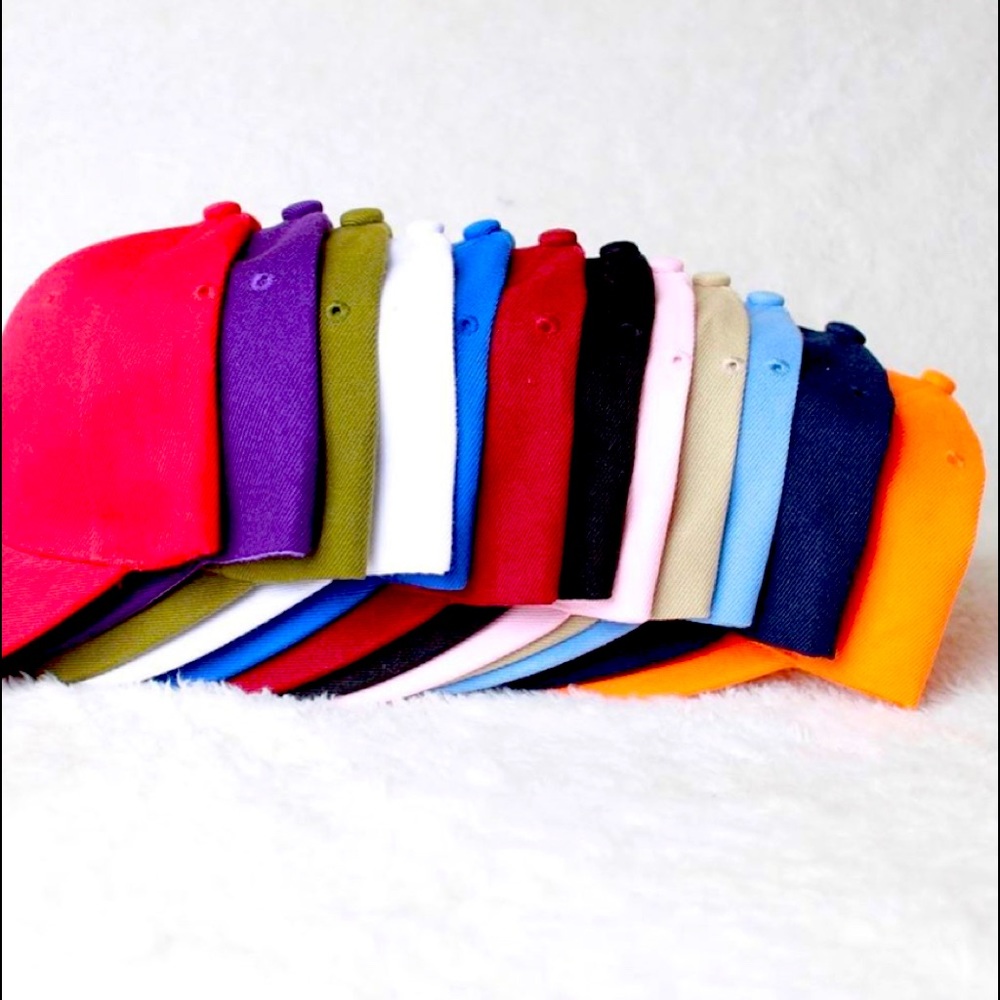 Brand new baseball caps with Velcro closure.